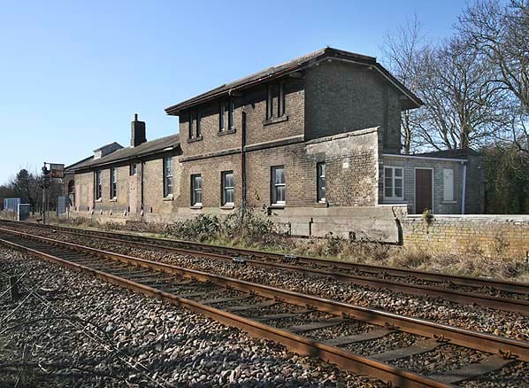 a building by train tracks